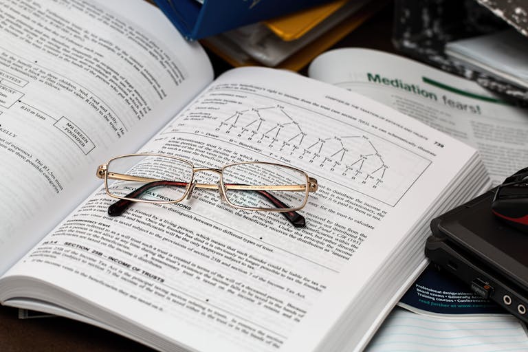 Eyeglasses on an Opened Book